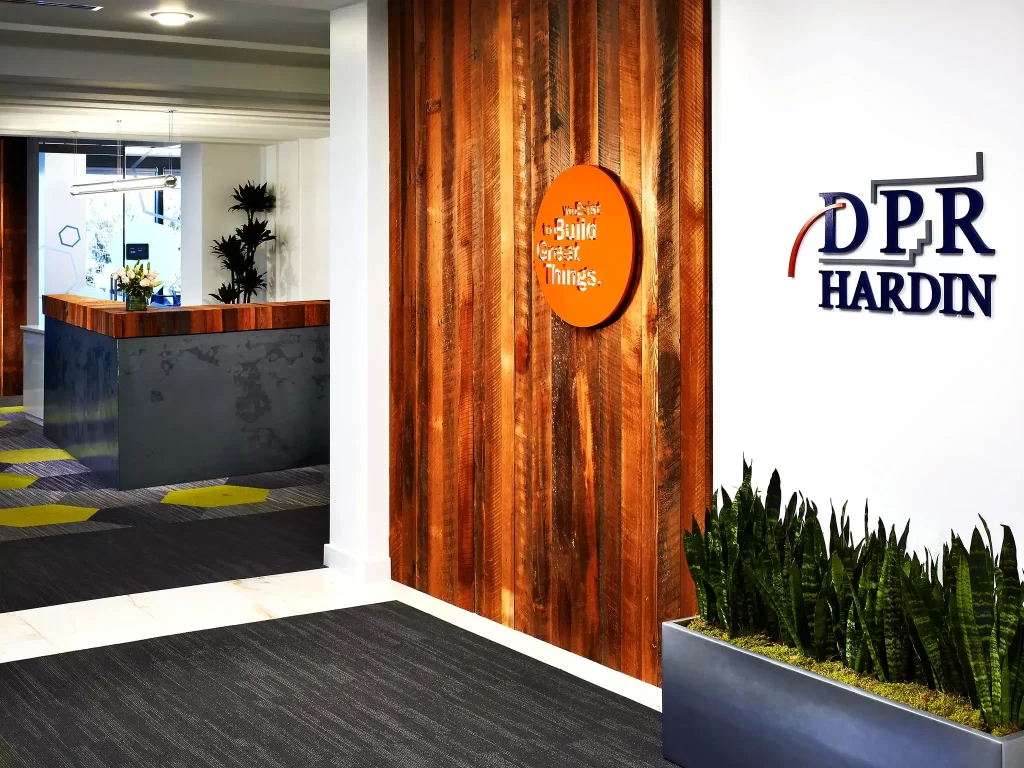 Corporate interior dimensional signage and custom fabrication by 360CSG showcasing DPR Hardin branding as part of professional case studies environments