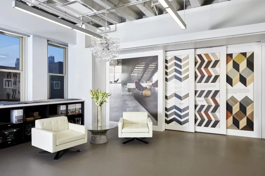 Mannington Custom Corporate Interior Branding | 360CSG Custom corporate interiors by 360CSG featuring large-format wallpaper graphics, custom fabricated wall displays, and branded window graphics for the Mannington showroom environment