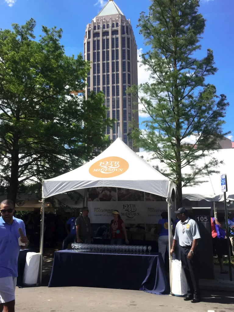 Branded event tent for 12th Midtown Atlanta, GA festival with custom logo and event signage