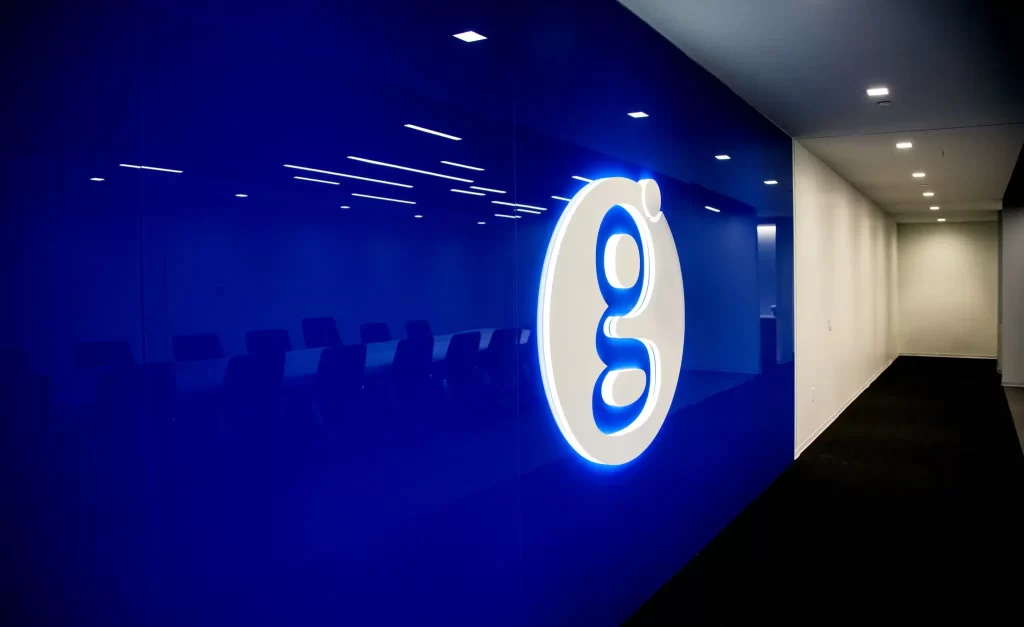 Global payments - Illuminated Dimensional Logo for Corporate Interior | 360CSG Custom corporate interiors by 360CSG featuring illuminated dimensional logo signage of "GLOBAL Payments", custom fabricated wall elements, and branded interior graphics within a modern corporate office environment in Sandy Springs, GA