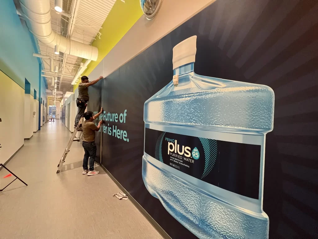 Large Format Wall Graphic Installation | 360CSG Large format wall graphic installation of Primo Plus water in Buckhead, Ga with bold typography by 360CSG