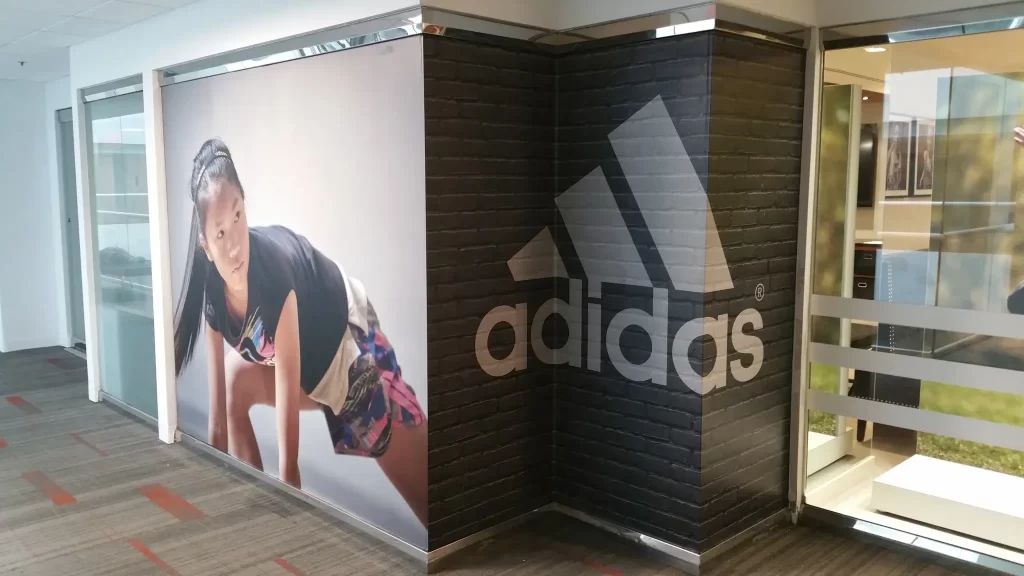 Adidas Branding Wallpaper graphics | 360CSG Wallpaper graphics & signage featuring Adidas branding and athlete image, designed by 360CSG in Roswell, GA