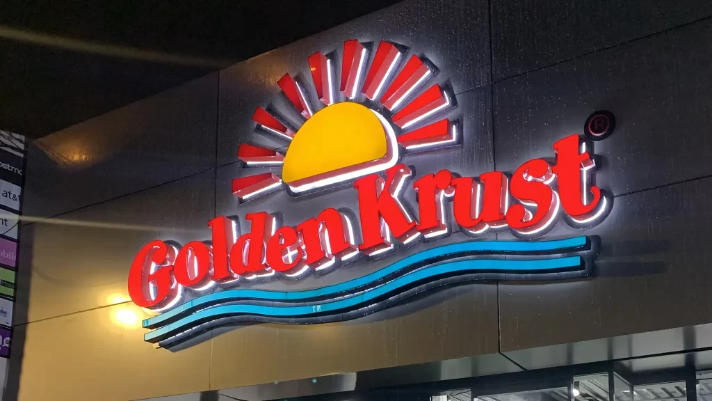 Golden Krust" Dimensional & Monument Exterior Sign – 360CSG | 360CSG Backlit dimensional exterior signage of "Golden Krust" including monument sign fabrication by 360CSG in Smyrna, GA