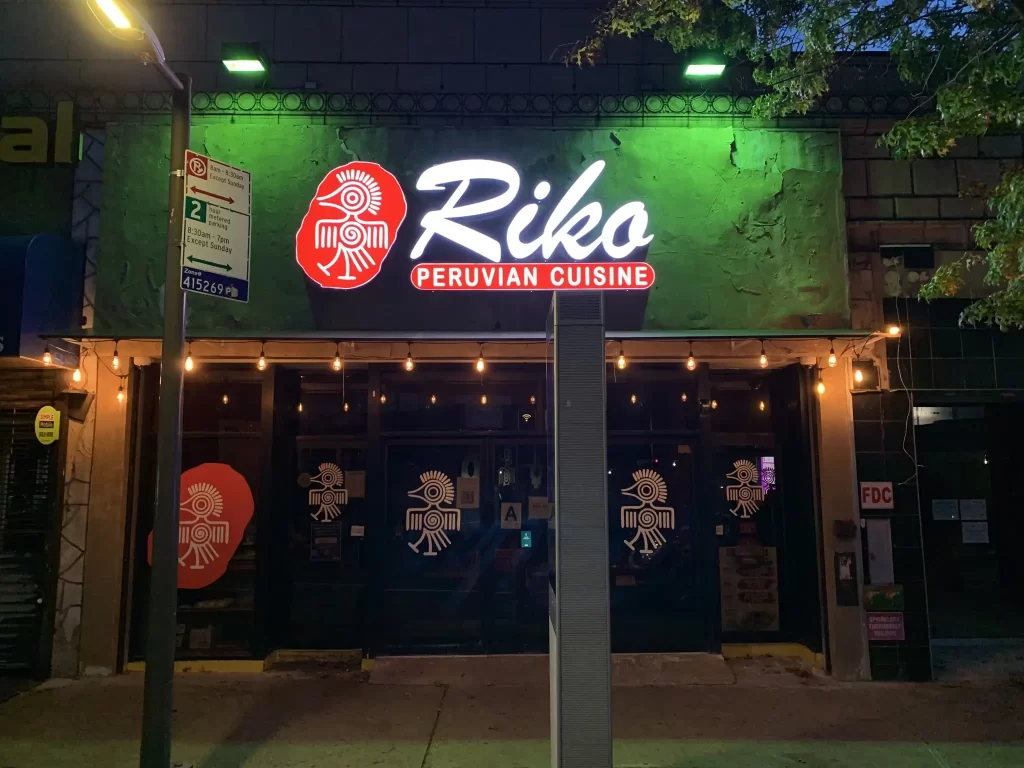 "RIKO" - Exterior singage & graphics -channel letter signs with illuminated branding and window graphics installed by 360CSG for a Peruvian restaurant storefront